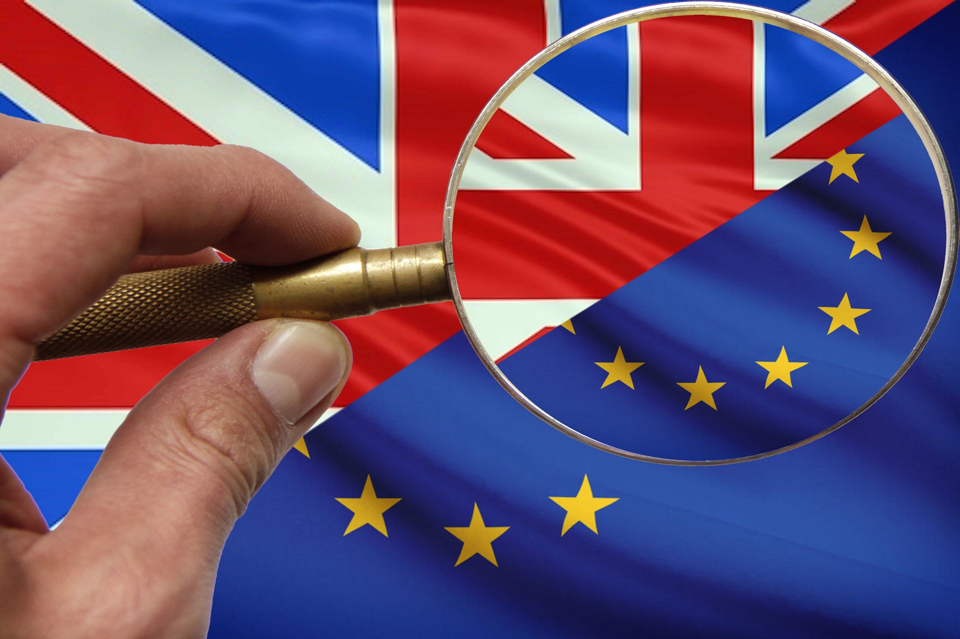 UK and EU flags under magnifying glass